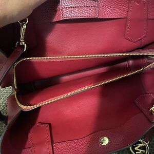 Michael Kors wine colored handbag with crossbody strap